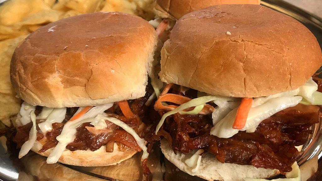 Pulled Pork Jackfruit Sliders · Marinated BBQ jackfruit with carrot, topped with a tangy and sweet slaw, on 3 slider buns, with a chipotle mayo spread.