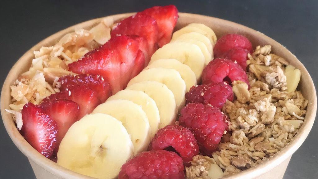 Strawberry Banana Bowl · Strawberry, banana, dates and hemp milk smoothie bowl. Topped with sliced strawberry, banana, raspberry and honey oat granola.