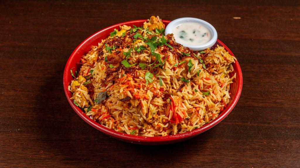 Classic Biryani · Classic biryani flavored with fresh herbs and spices infused into fragrant rice. Served with yogurt riata.