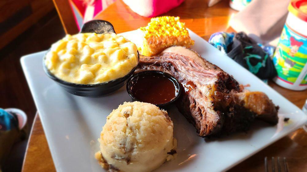 Smoked Beef Brisket · Half a pound of 14 hours oak-smoked beef brisket comes with mashed potatoes and choice of one side.