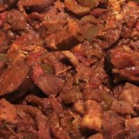 Jambalaya · Spicy southern favourite, tasso ham, sausage, pulled chicken, and bacon in a spicy tomato br...