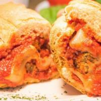 Meatball Sub · 3 Homemade XL-size 5 oz. meatballs, melted provolone, red sauce.
