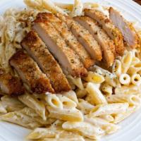 Alfredo Penne · Penne pasta with our homemade alfredo sauce.  Add a breaded chicken breast on top - you won'...