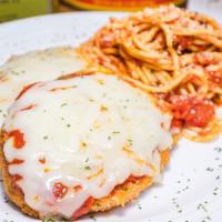 Chicken Parmesan · Tender breaded chicken baked with red sauce, and mozzarella cheese.  Served with a side of p...