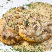 Chicken Marsala · Tender breaded chicken and mushrooms in a creamy marsala wine sauce.  Served with a side of ...