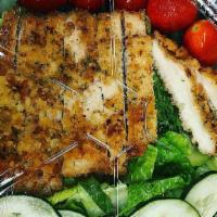 Chicken Salad · Hand-breaded chicken breast, cucumbers, cherry tomatoes and purple cabbage on top a bed of l...