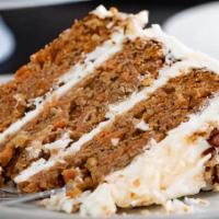 Carrot Cake · Homemade moist square of carrot cake topped with rich cream cheese frosting.