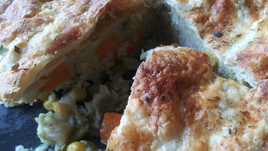 Veggielicious Pot Pie · For the veggie lovers. This pot pie is a favorite of my nephew Dylan. Packed with asparagus tips, baby peas, broccoli, cauliflower rice, potatoes, corn, carrots, and asparagus puree. Slowly cooked with vegetable broth, heavy cream, celery and asparagus puree, and veggie spices until thick topped with puff pastry and baked in the oven until golden brown. The pie does not have onions or garlic in it but the spices do contain onion and garlic powder. This is a 6-inch pie. Weighs 15 ounces. Enjoy Contains: Wheat, Egg, Soy, and Milk.