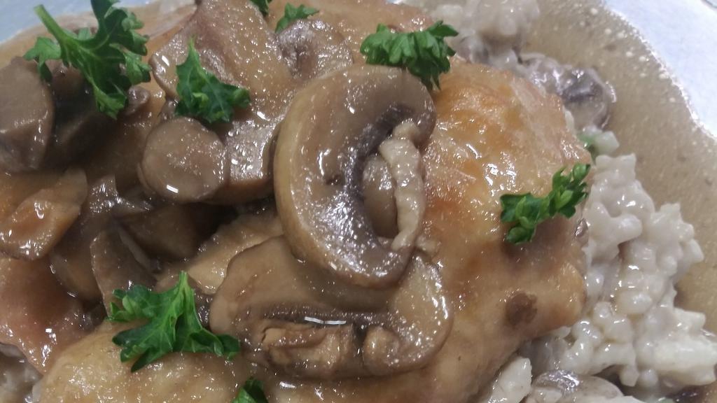 Chicken Marsala · For the mushroom lovers. The chicken marsala is a traditional Italian dish made with Marsala wine, chicken, and mushrooms. I make my sauce with Marsala wine, Pinot Noir, demi-glaze, mushroom broth, butter, flour, and truffle oil. The chicken breast is marinated in a mushroom broth, light floured with just kosher salt, pan-seared until tender, soak in the Marsala sauce and put on top of the risotto. The risotto is made with Arborio rice, heavy cream, grated parmesan, marinated mushrooms, haricot verts, Marsala sauce, and butter. Garnished with fresh chopped parsley. Weigh 1.75 pounds. Enjoy.