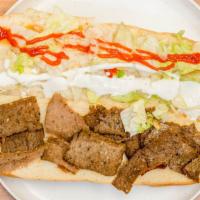 Gyro Sub · Appetizing gyro inside a sub with tomatoes & lettuce with our specially made hot and white s...