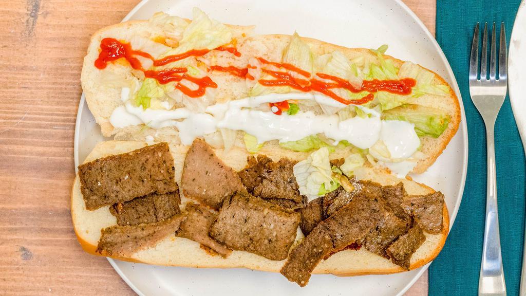 Gyro Sub · Appetizing gyro inside a sub with tomatoes & lettuce with our specially made hot and white sauce.