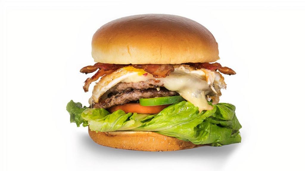 Cajun Sunrise · Double patty burger. 100% Certified Angus Beef, never frozen, no additives, no fillers. Served on toasted brioche bun. Pepper Jack cheese, bacon, fried egg, bleu cheese sauce, lettuce, tomato, fresh jalapeno, and Cajun seasoning. Choose your included toppings below