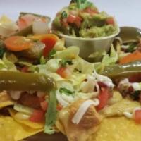Nachos Locos · Nachos locos comes with your choice of meat, beans, jalapeno cheese and toppings from our sa...
