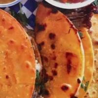 Birria Taco · 2 small corn tortillas deep in barbacoa juice, grilled with mozzarella cheese, onion, cilant...