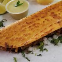 Macheton · 20 inch fresh made corn tortilla fill with cheese, your choice of meat, sour cream, onions, ...