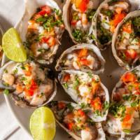 1/2 Docena Ostiones Preparados · !/2 dozen of raw oysters served with ceviches on top