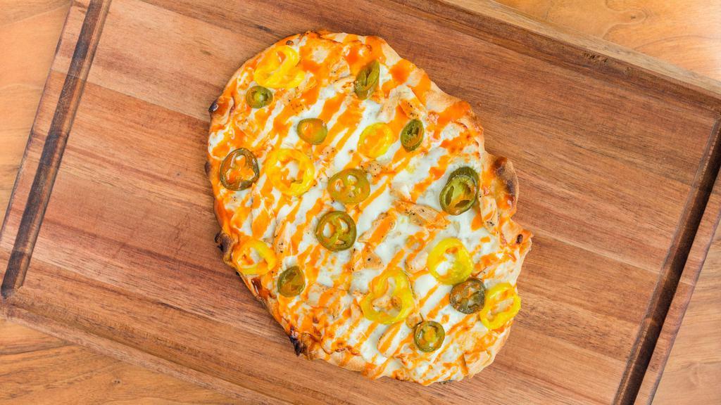 Buffalo Chicken - Personal · Olive oil base, topped with mozzarella cheese, seasoned chicken, jalapenos and banana peppers. Finished with a buffalo sauce drizzle.