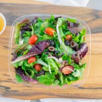 Italiano · Spring mix, black olives, tomatoes and red onions, with a delicious Italian dressing.