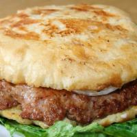 Pljeskavica/Sandy'S Burger · Serbian beef burger topped with onions and kajmak, with homemade fried potatoes.