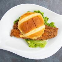 Remoulade Catfish “Po Boy” Sammie · Perfectly golden fried catfish on a buttery brioche bun, lettuce and our homemade remoulade ...