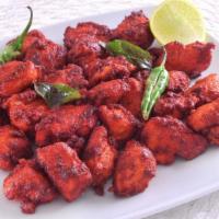 Chicken 65 · Boneless Chicken Marinated In Yogurt Cooked With Spices And Curry Leaves.