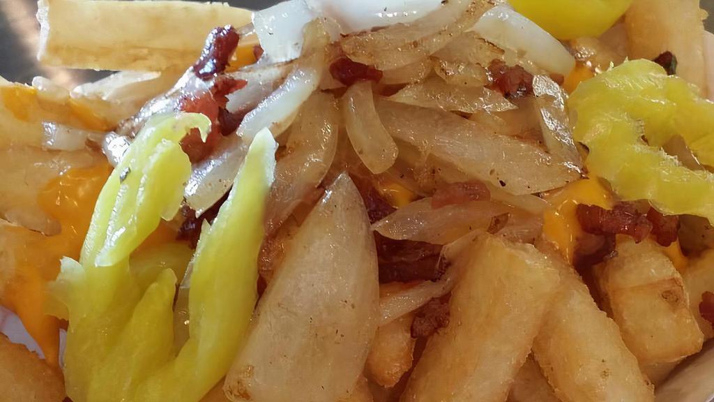 Loaded French Fries · Load your fries with cheese, real bacon bits, and optional sauteed onion, banana peppers and house ranch Dressing.