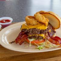 Double Midwestern Burger · Two onion rings, lettuce, tomato, grilled onion, BBQ sauce & bacon.