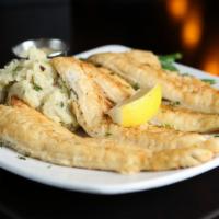 Sautéed Lake Perch · Fresh lake perch sautéed and lightly breaded. Served with a side of lemon butter caper sauce.