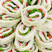 Pinwheels · Soft Lavash bread layered with cream cheese, Primo Taglio ham, turkey breast, provolone, red...