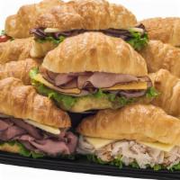 Croissant Sandwiches · Flaky light and buttery croissants layered with a variety of Primo Taglio ham, roast beef, p...