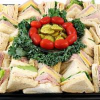 Finger Sandwich Tray · Primo Taglio turkey breast and ham with American and Swiss cheese on white and wheat bread. ...