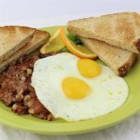 Hash & Eggs · Corned beef hash covered with two fresh-cracked eggs any style.