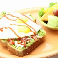 Avocado Toast · Avocado lovers rejoice! Our breakfast spin on a delicious new trend; wheat toast covered in ...