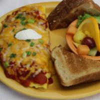 South Of The Border Omelette · Stuffed with chorizo sausage, green chilies, onions, homemade salsa, a blend of monterey jac...