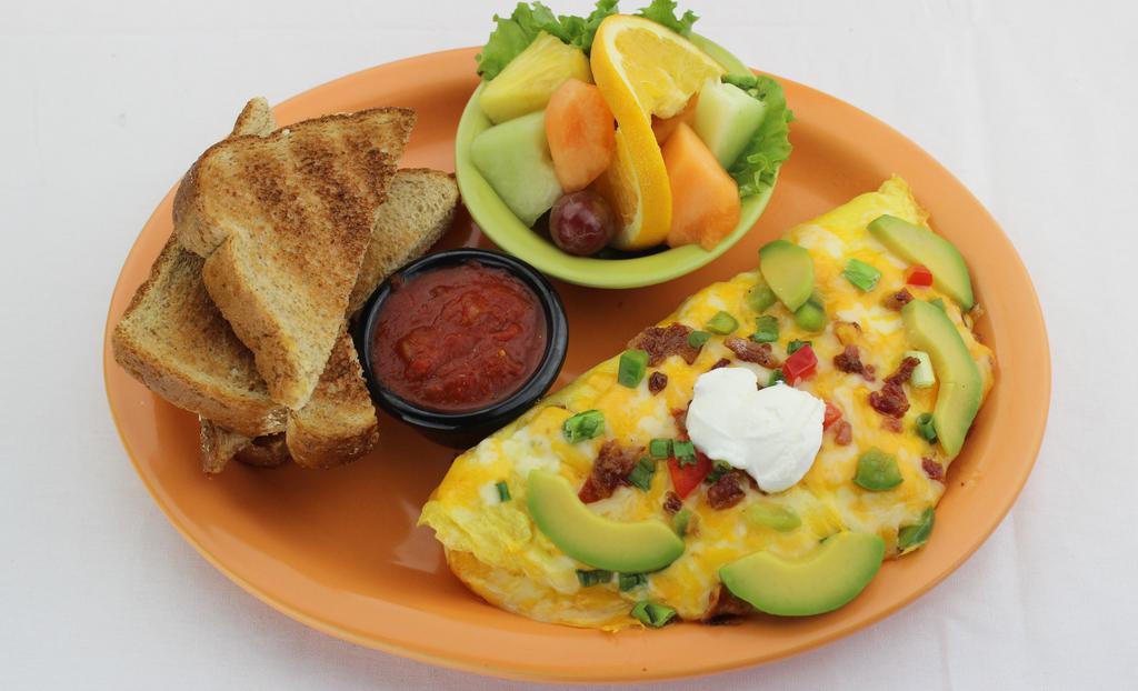Awesome Avocado Omelette · Stuffed with ripe avocado, lean bacon, bell pepper, a blend of monterey jack and cheddar cheeses, and topped with sour cream and chives. Served with our homemade salsa. Add-ons for an additional charge. Comes with your choice of sides.