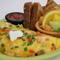 Chicken Fajita · Seasoned chicken breast, bell peppers, onions, diced tomatoes, a blend of monterey jack and ...