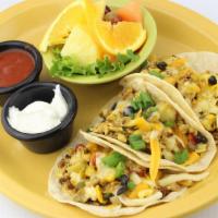 Breakfast Tacos · Three corn tortillas filled with our fresh cracked eggs, scrambled with chorizo sausage, bla...