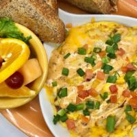 Southwest Frittata · Cheddar and Monterey Jack cheese, chicken, diced bacon, onions, tomatoes, and jalapenos blen...