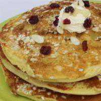 Oatmeal Cinnamon Cakes · Oats, brown sugar, and cinnamon baked into three of our homemade pancakes. Topped with pecan...