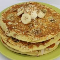 Banana Nut Cakes · Bananas, crunchy granola and almonds baked into three of our homemade pancakes. Topped with ...