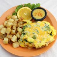 Open-Faced Smothered Croissant · Scrambled eggs mixed with spinach, diced ham, and a blend of monterey jack and cheddar chees...