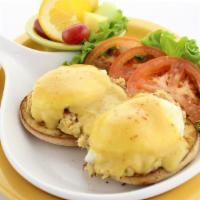 Crab Cake Benny · Two Maryland-style crab cakes made with 100% blue crab, topped with two poached eggs on a to...