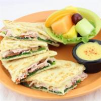 Turkey Flatbread · Natural honey smoked turkey, spinach, tomatoes, and swiss cheese pressed into a one-of-a-kin...