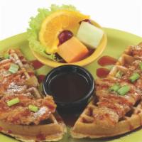 Chicken And Waffles · Breaded chicken tenders on a Belgian waffle, sprinkled with powder sugar and chives.  Served...
