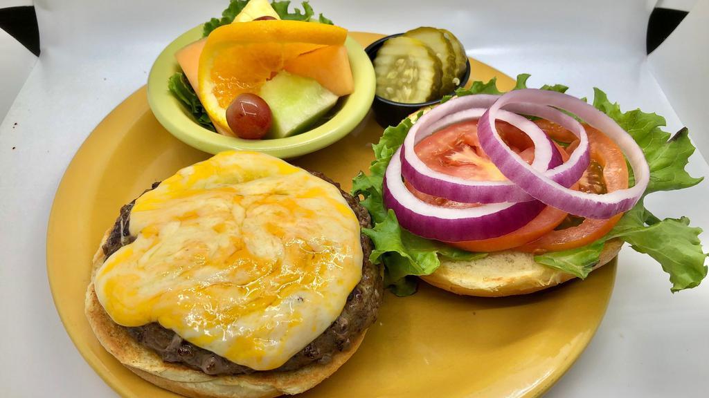 Angus Cheeseburger (1/2 Lb) · Half pound burger with a blend of monterey jack and cheddar cheeses. Served with lettuce, tomato, pickle, and onion on a fresh brioche roll.