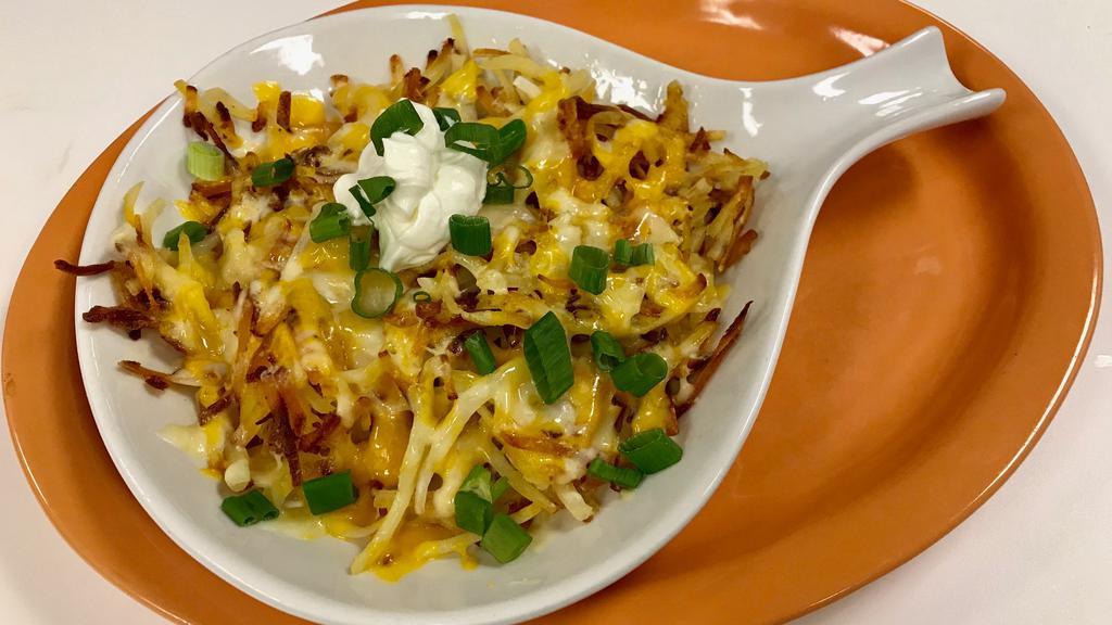 Loaded Hash Browns · Sour cream, cheese and chives.