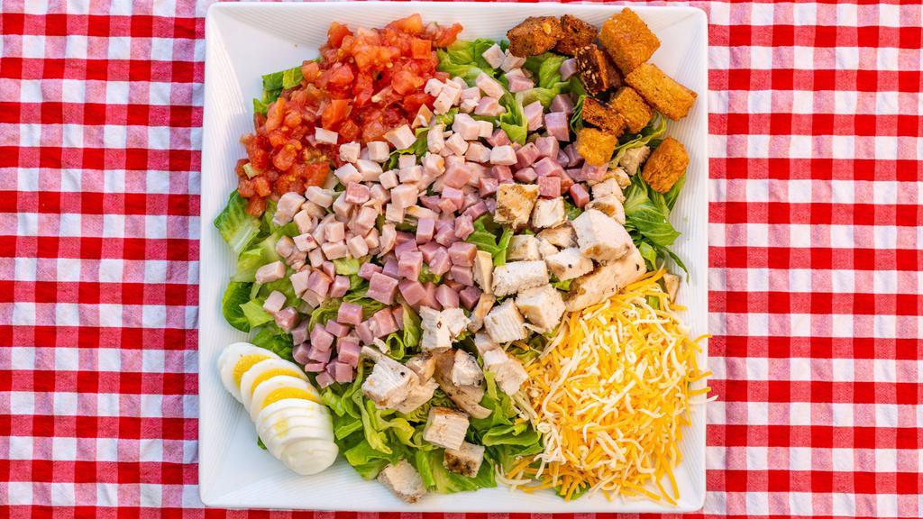 Chef Salad · Romaine, ham, turkey, grilled chicken, shredded Monterey Jack cheese, hard-boiled egg, tomato, and croutons.