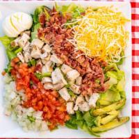Cobb Salad · Romaine, chicken, bacon, onion, tomato, avocado, shredded Monterey Jack cheese, and a hard-b...