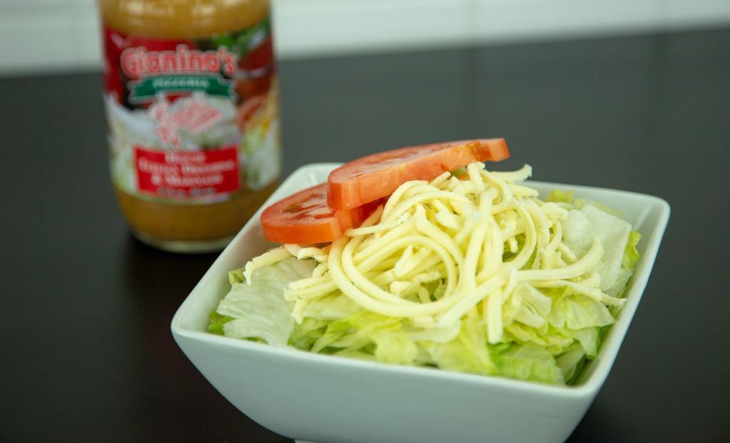 Tossed Salad · Lettuce, tomato, provolone cheese & your choice of dressing.