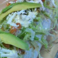 King Burrito · Choice of meat, with rice, beans, lettuce, pico de gallo, avocado, cheese & sour cream.